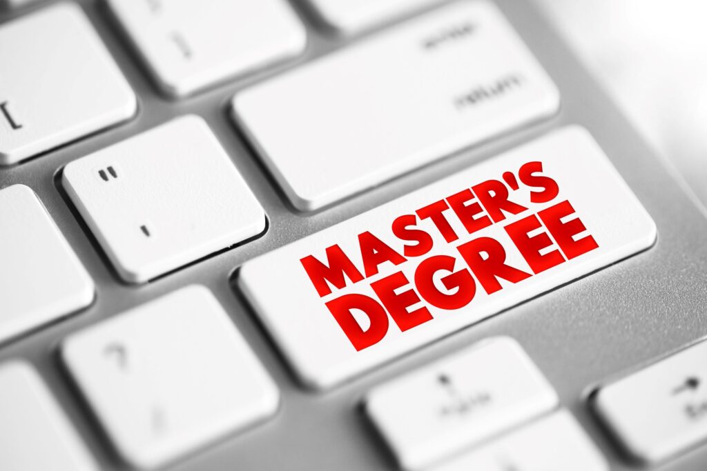A close up of a computer key that says “master’s degree” instead of “enter.”