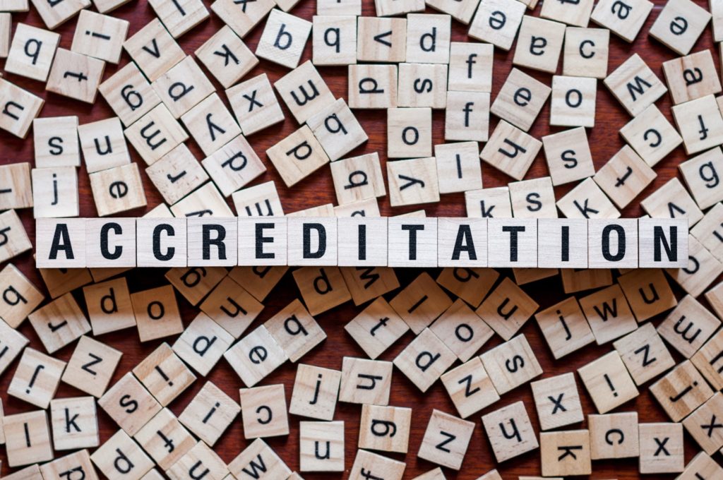 ‘Accreditation’ spelled out with letter blocks.